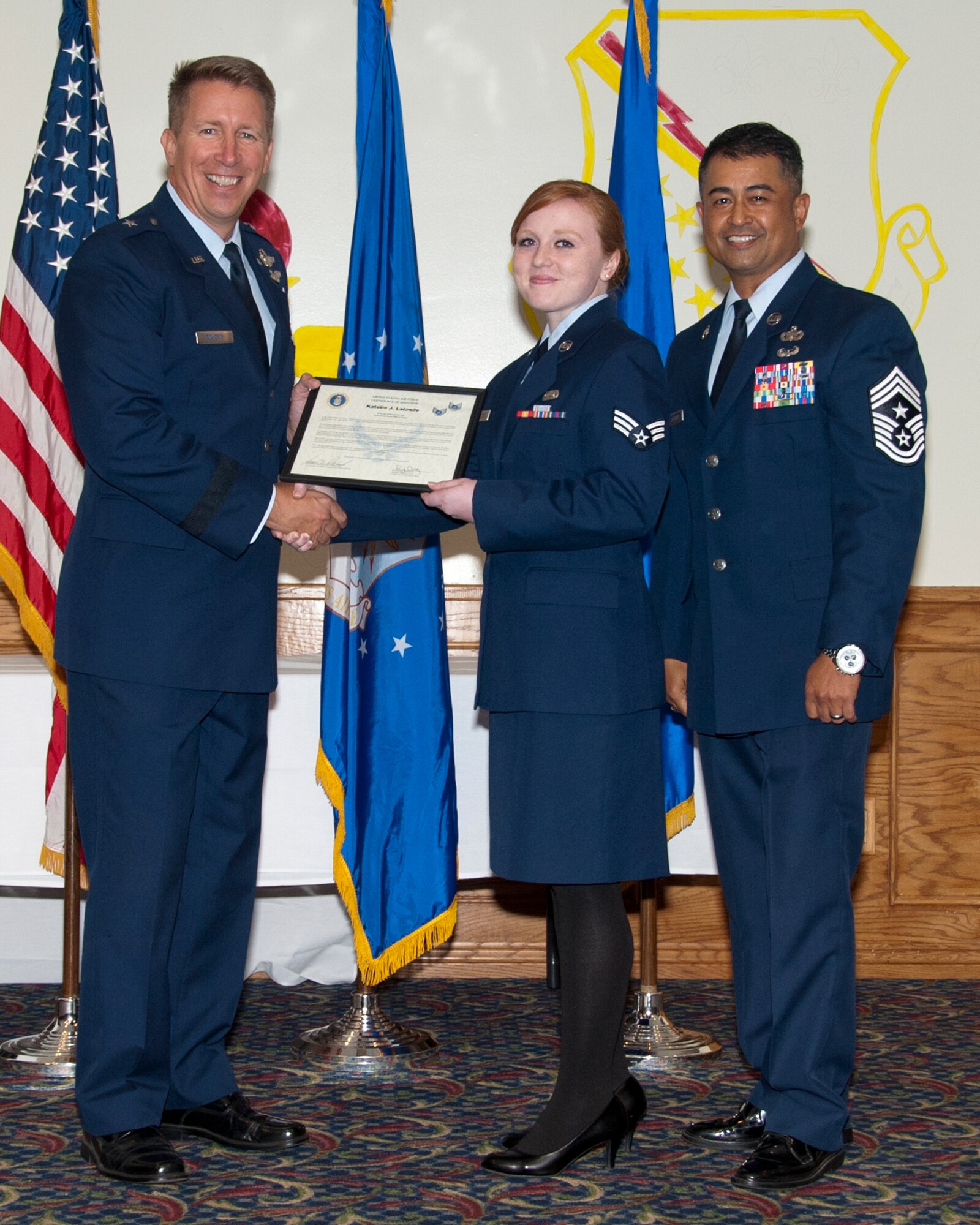 Brig. Gen. Patrick J. Doherty, 82nd Training Wing commander, and Chief Master Sgt. Joseph Pritchard, 82nd Training Wing command chief master sergeant, present Senior Airman Katelin Lalonde, 82nd Training Wing Administration journeyman, with her certificate of promotion to the rank of staff sergeant during the Noncommissioned Officer Induction Ceremony at the Sheppard Club, Sept. 22, 2015.  The U.S. Air Force is proud of the NCO corps development and is one of the few nations who train their enlisted Airmen, giving them responsibilities some military forces wouldn’t consider giving to officers. 
(U.S. Air Force photo/Frank Carter)
