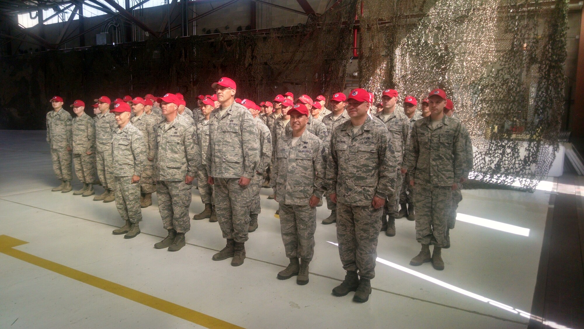 Members of the New Mexico Air National Guard’s 210th Rapid Engineer Deployable Heavy Operational Repair Squadron Engineers assemble at a yellow-ribbon ceremony held for the squadron. The 210 RED HORSE deployed to Asia on its first combat assignment. (Photo by Ryan Stark)