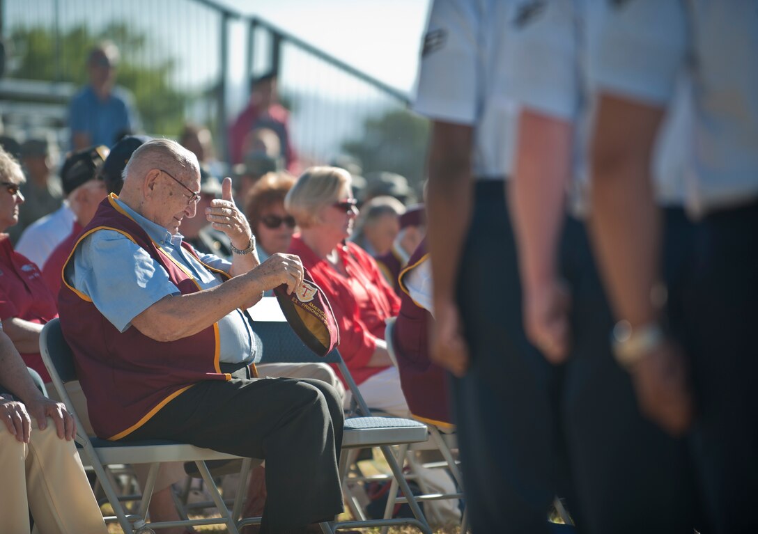 A former prisoner of war wipes his face during the Prisoners of War/Missing in Action Recognition Ceremony at Nellis Air Force Base, Nev., Sept. 18, 2015. Many former POWs and military veterans joined Nellis AFB Airmen in honoring the nation’s POWs and those MIA. (U.S. Air Force photo by Staff Sgt. Siuta B. Ika)