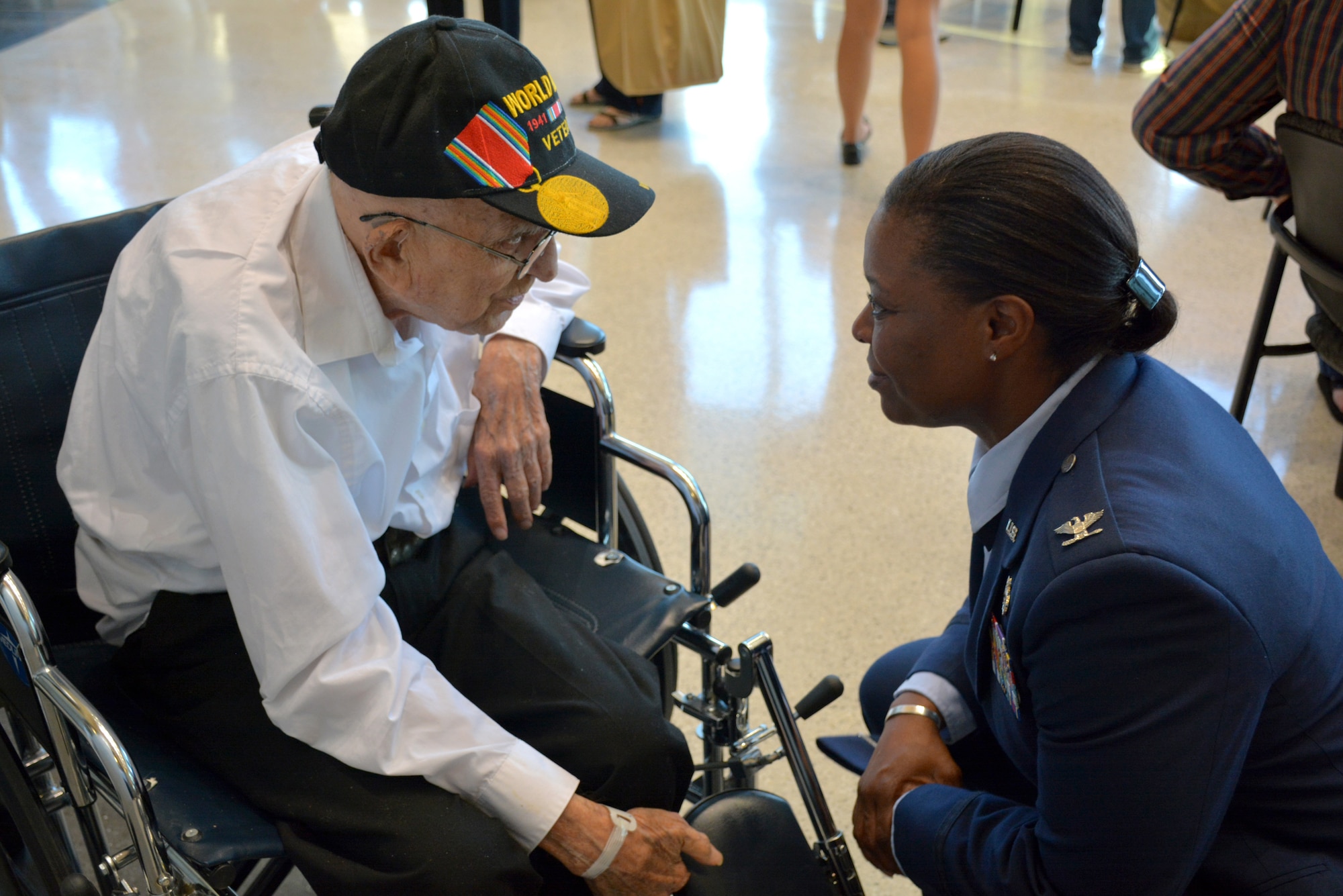 Col. Stephanie Wilson, 72nd Air Base Wing and installation commander, talks with Bob Hedgecoke, 93, of Guthrie, during a sendoff reception for Honor Flight veterans Sept. 15 at Rose State College. Mr. Hedgecoke was a radio repairman during World War II, assigned to the 551st Signal Battalion, 3rd Army. He was one of 81 veterans taking part in an Oklahoma Honor Flight last week that took the WWII and Korean War veterans from Oklahoma City to Washington, D.C., to visit memorials built in their honor. (Air Force photo by Darren D. Heusel/Released)