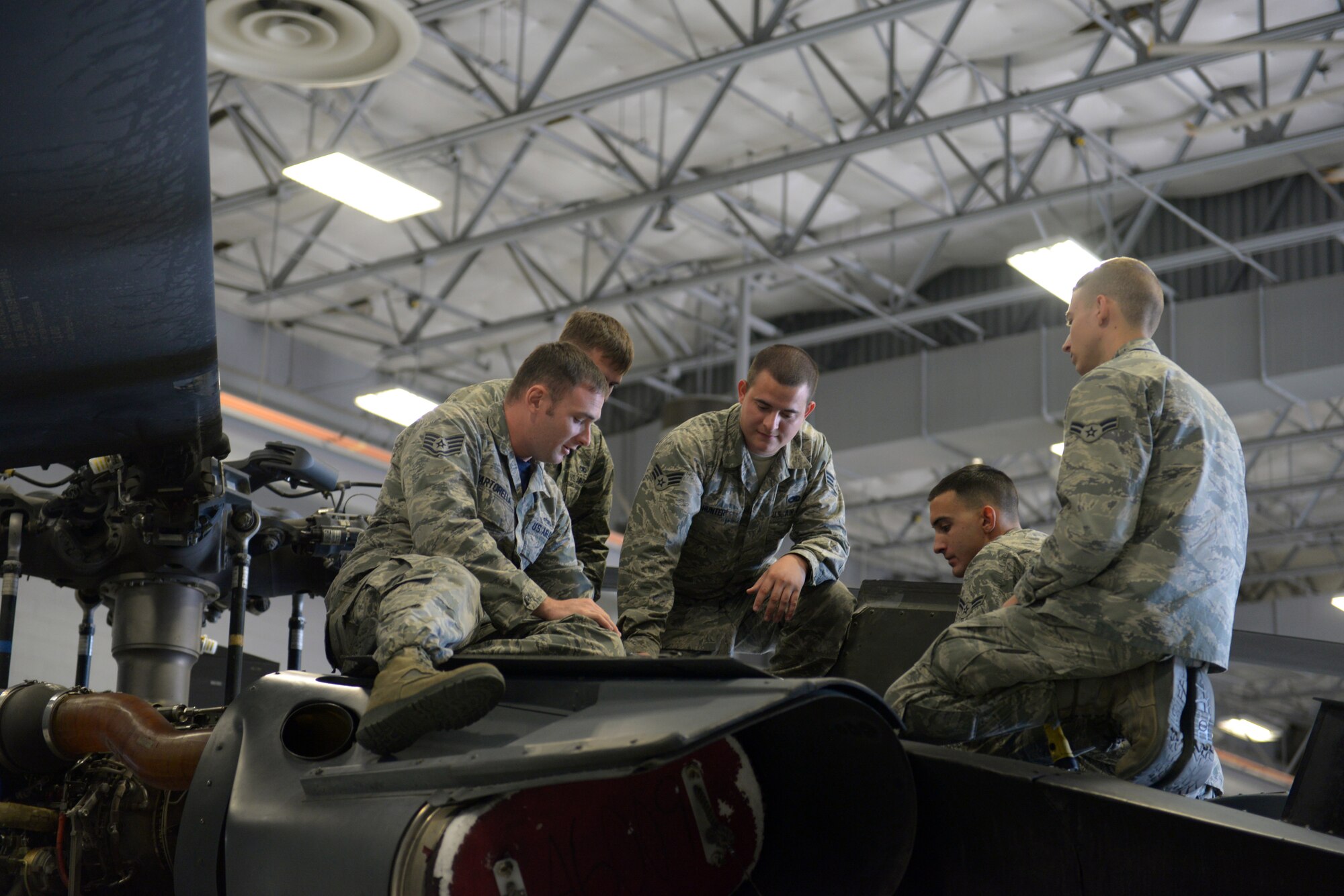 Staff Sgt. Ryan Martorella, Detachment 13, 372nd Training Squadron HH-60G pave Hawk crew chief instructor, teaches a specialized advanced training class at the 823rd MXS hangar on Nellis Air Force Base, Nev., Sept. 19, 2015. Detachment 13 is an Air Education and Training Command detachment with approximately 35 instructors across 15 Air Force Specialty Codes (U.S. Air Force photo by Airman 1st Class Rachel Loftis)