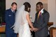 Chaplain (Capt.) Eli Dowell, 375th Air Mobility Wing chaplain, prays with a couple being married at the Scott Air Force Base chapel. Dowell provides pastoral care, counseling and religious education to Scott personnel and their families. (U.S. Air Force Photo by Senior Airman Megan Friedl)