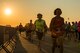Runners cross the taxiway on the flightline at Barksdale Air Force Base, La., Sept. 19, 2015, during the 2015 Half Marathon and 5K hosted by the 2nd Force Support Squadron. Nearly 300 participants from on and off base, including runners aged 9-69, as well as kids on bikes and others towed in strollers and wagons, joined to race. (U.S. Air Force photo/Staff Sgt. Tyler Prince)