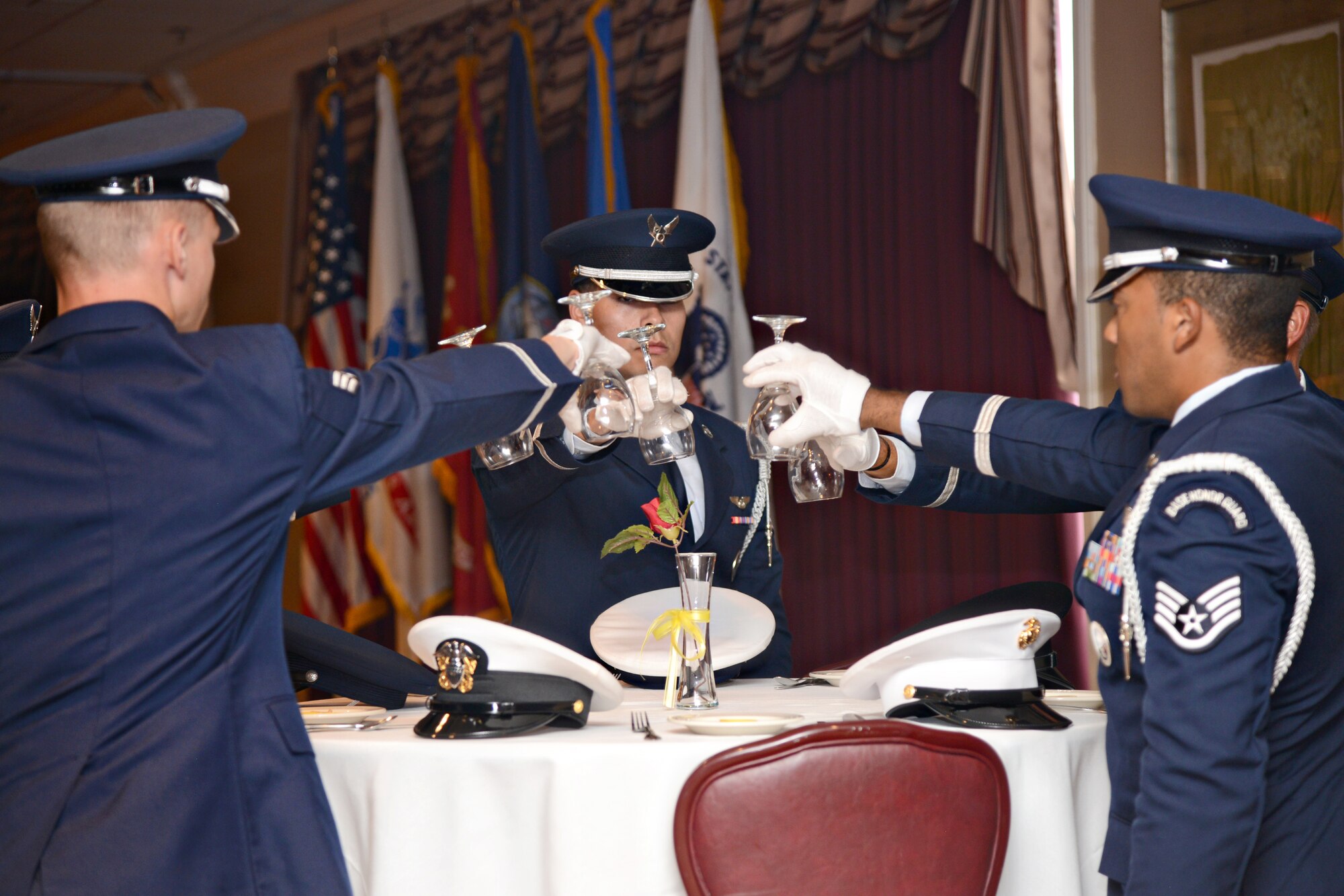 During the POW/MIA breakfast Sept. 18, members of the Tinker Honor Guard perform a table ceremony in memory of all of the servicemen and women who were taken captive or are still missing. (Air Force photo by Kelly White/Released)