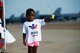 Daughter of Tech. Sgts. Shanaysha and Edwin Evans of the 2nd Force Support Squadron and Air Force Global Strike Command, works a water station for runners crossing the taxiway on the flightline at Barksdale Air Force Base, La., Sept. 19, 2015. The 2nd  FSS hosted the 2015 Half Marathon and 5K to build relationships between the on and off base communities. (U.S. Air Force photo/Tech. Sgt. Thomas Trower)