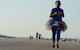 Angel Kaylor crosses the taxiway on the flightline at Barksdale Air Force Base, La., Sept. 19, 2015, during the 2015 Half Marathon and 5K hosted by the 2nd Force Support Squadron. Nearly 300 participants from on and off base, including runners aged 9-69, as well as kids on bikes and others towed in strollers and wagons, joined to race. (U.S. Air Force photo/Tech. Sgt. Thomas Trower)