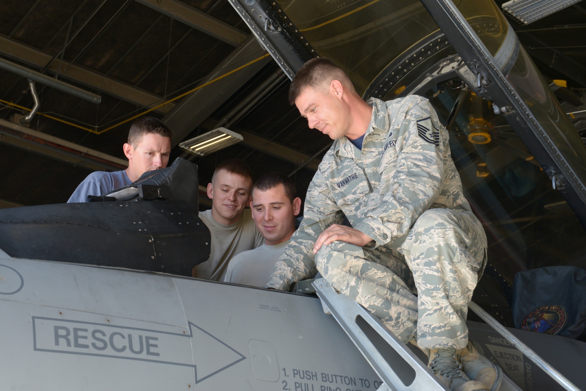 Master Sgt. Branden Van Matre, Detachment 13, 372nd Training Squadron F-16 Fighting Falcon crew chief instructor, teaches an advanced dedicated crew chief class on Nellis Air Force Base, Nev., Sept. 19, 2015. Students will learn many useful skills to utilize in their day-to-day jobs while attending the three-week class. (U.S. Air Force photo by Airman 1st Class Rachel Loftis) 