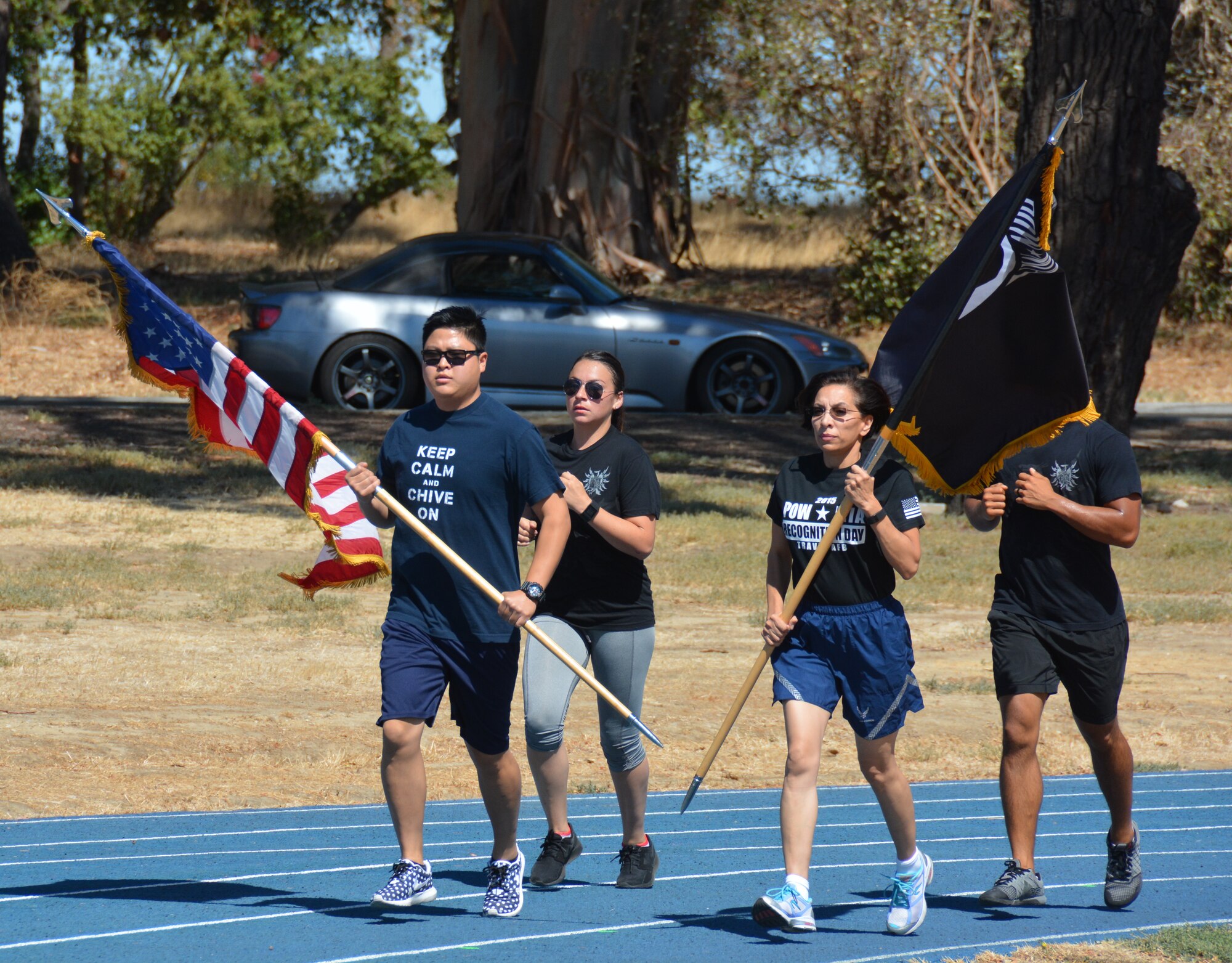 TRAVIS AIR FORCE BASE, Calif. -- Travis Team members run with Honor Guard Airmen, and active duty delayed enlistment trainees, during the 24-hour POW/MIA Vigil Run Sept.18 2015. (U.S. Air Force photos/Ellen Hatfield)

