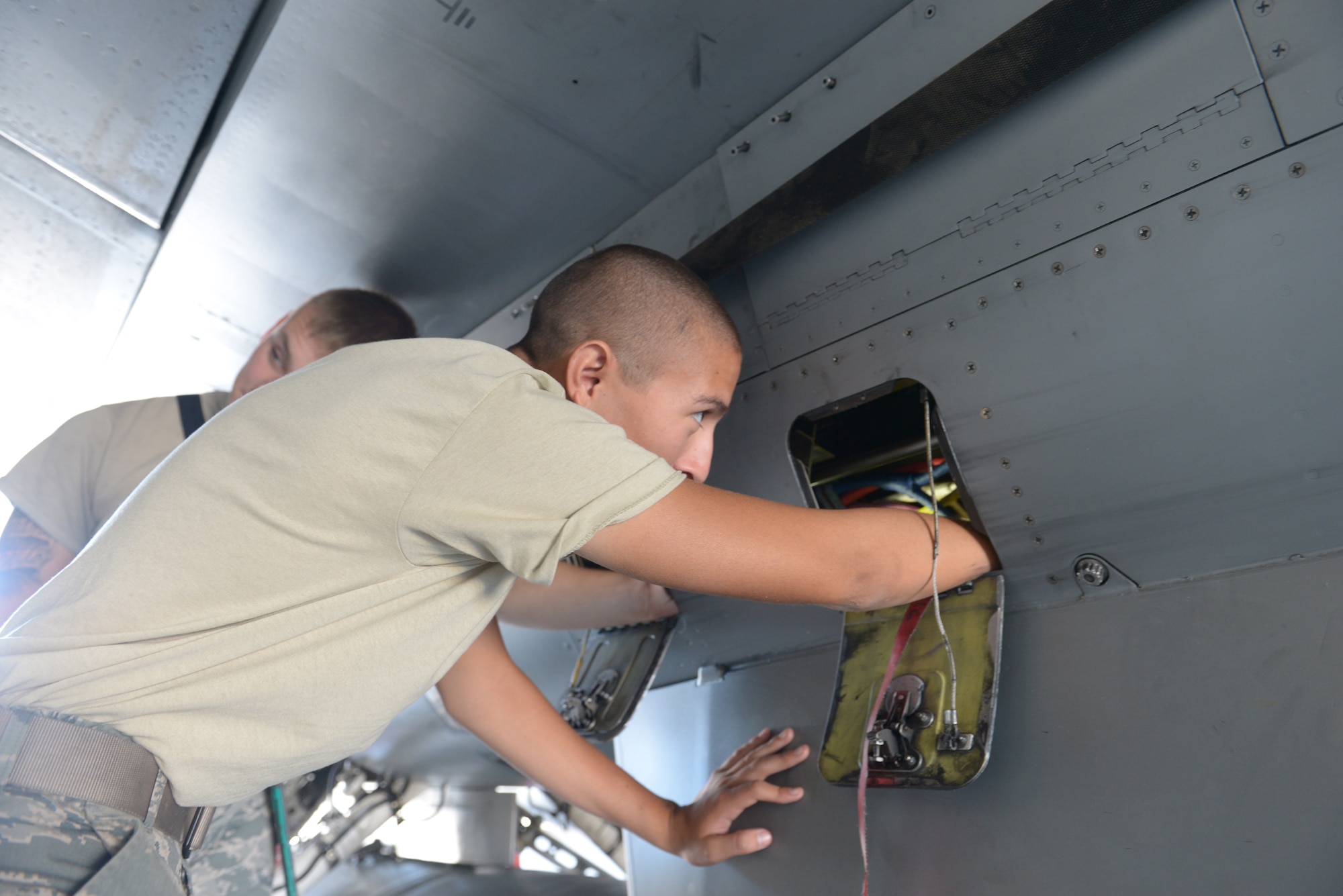 Airman Edgar Avila, 57th Aircraft Maintenance Squadron Tomahawk Aircraft Maintenance Unit F-16 Fighting Falcon crew chief, performs a throttle control assembly at Nellis Air Force Base, Nev., Sept. 19, 2015. The throttle control assembly is just one of many objectives students of the advanced dedicated crew chief class will learn while attending the three-week course, which is hosted by Detachment 13, 372nd Training Squadron. (U.S. Air Force photo by Airman 1st Class Rachel Loftis)