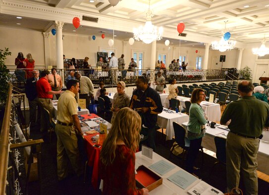 Military members and other federal employees roam from table to table to meet representatives from 35 charitable organizations during the 2015 Combined Federal Campaign kickoff event Sept. 22, 2015, held at Maxwell Air Force Base, Alabama. This year, federal employees have their pick of over 22,000 charitable organizations to support. (U.S. Air Force photo by Airman 1st Class Alexa Culbert)