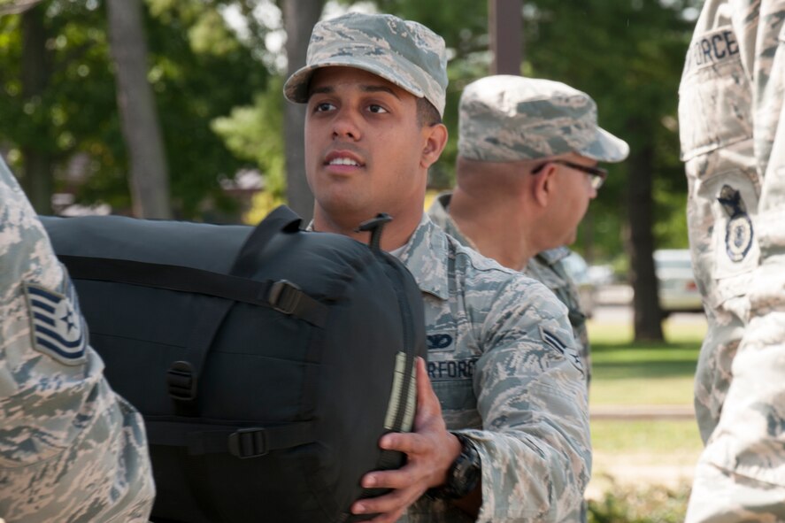 Airman 1st Class Steven Vinamarte carries his gear towards the 108th Logistic Readiness Squadron staging area at Joint Base McGuire-Dix-Lakehurst, N.J., Sept. 24, 2015. More than 25 Airmen from the 108th Wing, New Jersey National Guard, loaded their gear onto a truck and boarded a bus headed to the New Jersey Army National Guard's Woodbury Armory to support local authorities in maintaining public safety during Pope Francis visit to the Philadelphia area. The Airmen were called to active duty by New Jersey governor, Chris Christie, in preparation for the Pope's visit. (U.S. Air National Guard photo by Tech. 
Sgt. Armando Vasquez/Released)