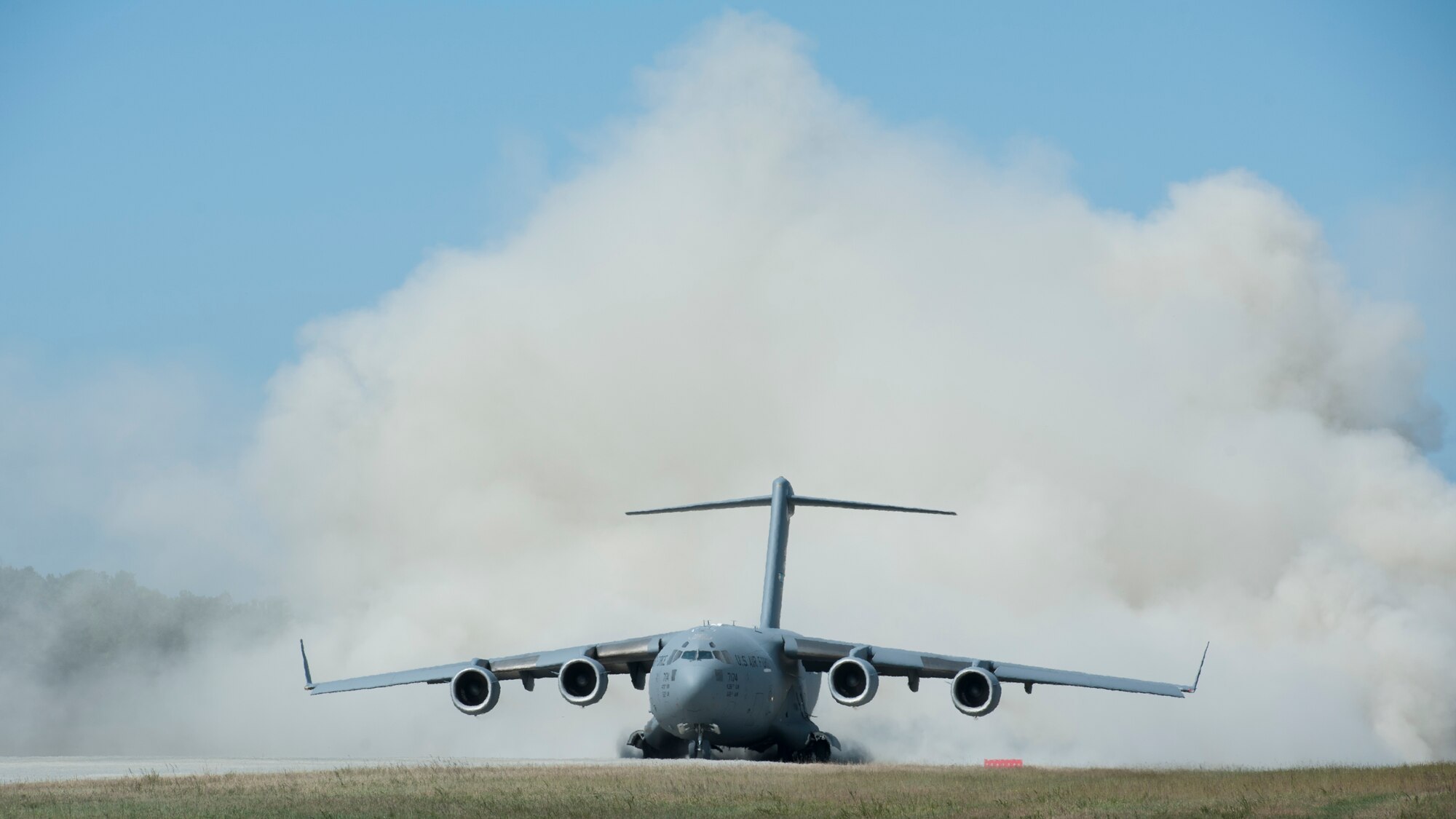 The jet engine blast from a C-17A Globemaster III, operated by the 3d Airlift Squadron, kicks up clouds of dirt and dust during a semi-prepared runway operations (SPRO) training mission Sept. 23, 2015, at Fort A.P. Hill, Va. The 3d AS sent multiple aircraft and aircrews throughout the week for SPRO training. (U.S. Air Force photo/Airman 1st Class Zachary Cacicia)