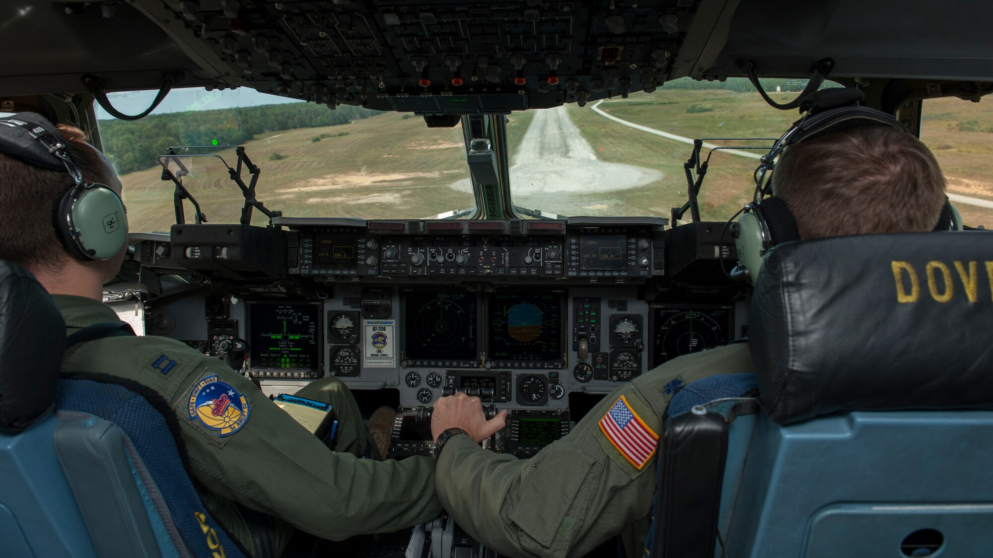 Capt. Matt Kurtz, 3d Airlift Squadron pilot, and Lt. Col. Mark Radio, 436th Airlift Wing Safety chief, position a C-17A Globemaster III to land on a dirt and gravel runway during a semi-prepared runway operations (SPRO) training mission Sept. 23, 2015, at Fort A.P. Hill, Va. The crew performed multiple landings and take-offs on Fort A.P. Hill’s 3,563 foot runway. (U.S. Air Force photo/Airman 1st Class Zachary Cacicia)