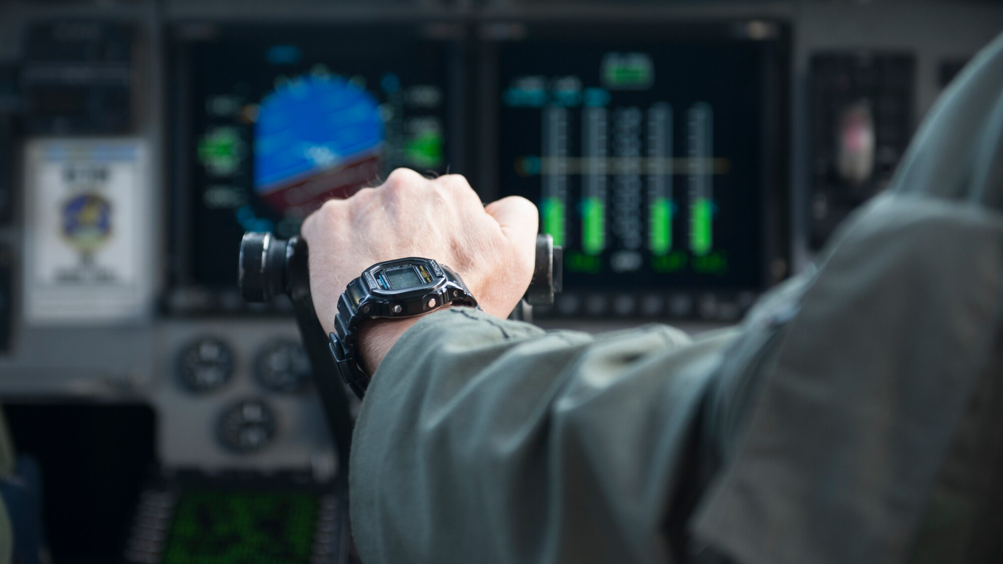 Lt. Col. Mark Radio, 436th Airlift Wing Safety chief, adjusts the engine throttle of a C-17A Globemaster III during a semi prepared runway operations (SPRO) training mission Sept. 23, 2015, above Fort A.P. Hill, Va. Radio has piloted C-17s for the past nine years. (U.S. Air Force photo/Airman 1st Class Zachary Cacicia)