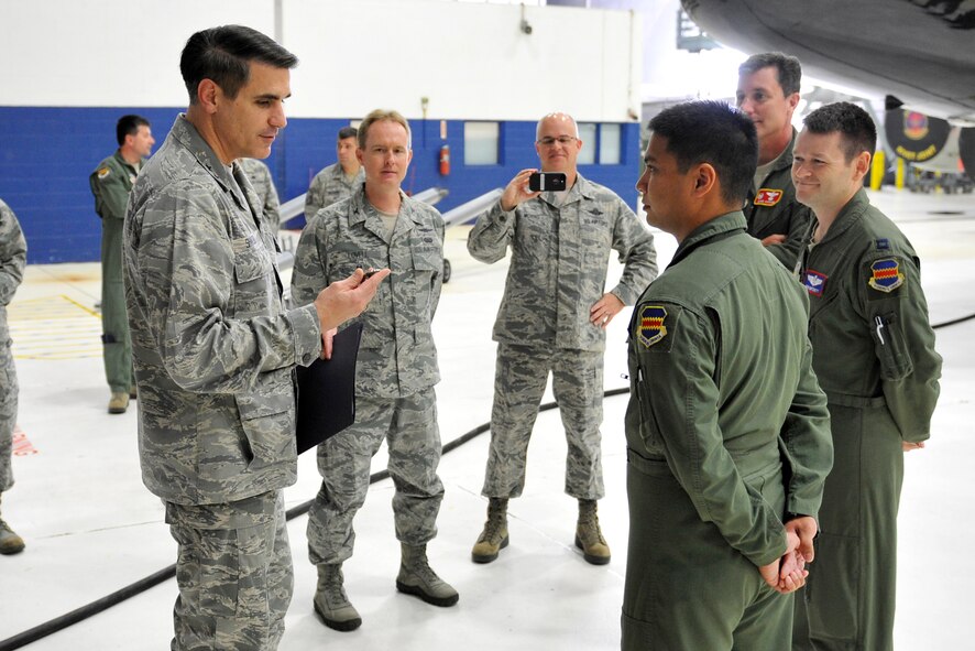 U.S. Air Force U.S. Air Force Maj. Gen. Bradford Shwedo, 25th Air Force commander, presents a commander’s coin to U.S. Air Force Senior Airman Jan Bowley, 343rd Reconnaissance Squadron, for his recent valiant effort during a first responder emergency accident in Bellevue, Neb. Shwedo and the 25th Air Force command chief visited Offutt Air Force Base, Neb. from Sept. 21-23. (U.S. Air Force photo / Jeff W. Gates/Released)