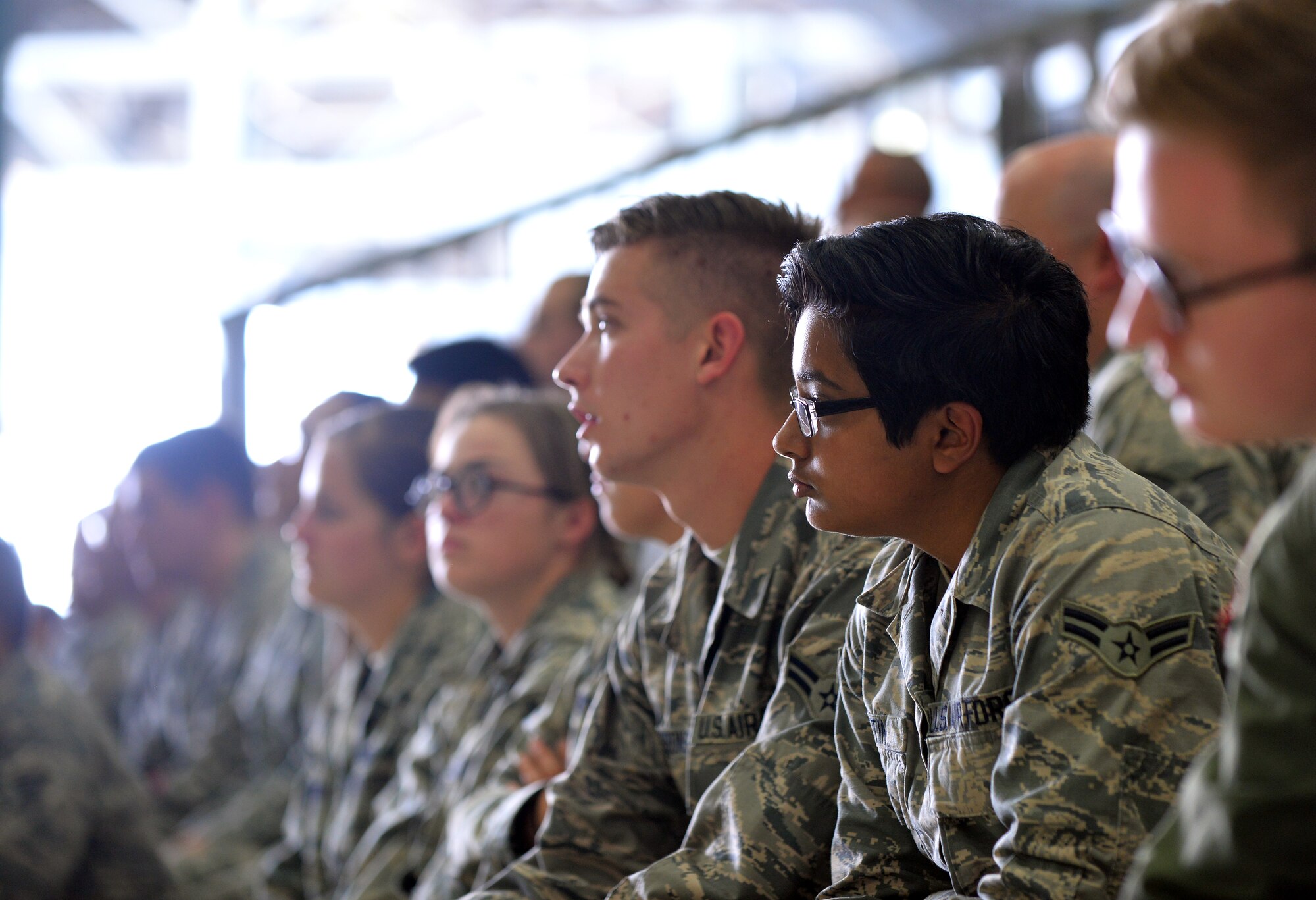 U.S. Air Force Maj. Gen. Bradford Shwedo, 25th Air Force commander, walks to the front of a hangar inside the Bennie Davis Maintenance Facility to address Airmen of the 55th Wing on Sept. 22, Offutt Air Force Base, Neb.  Shwedo talked about the synergy created by now having all of these units together under one umbrella within the 25th AF and also took some questions and answers from those in attendance. (U.S. Air Force photo / Josh Plueger/released)