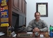 Capt. Carlos Cueto Diaz, 11th Wing assistant staff judge advocate, sits in his office Sept. 24, 2015, on Joint Base Andrews, Md. Cueto Diaz recently receive the 2015 National Organization for Mexican American Rights Meritorious Service Award. (U.S. Air Force photo by Senior Airman Preston Webb)
