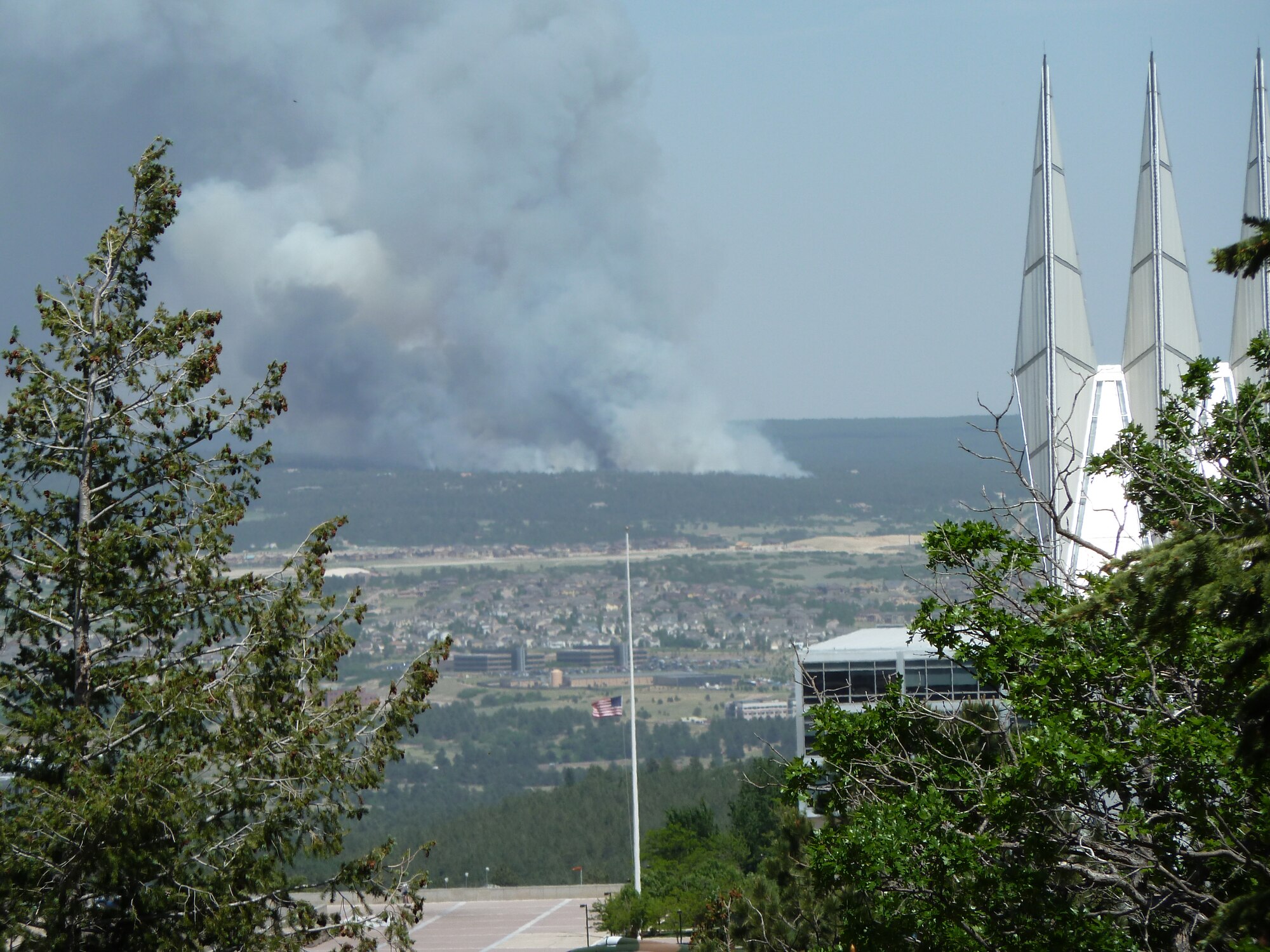 Smoke from the Black Forest fire in 2013 is seen from a window of Harmon Hall at the U.S. Air Force Academy.The fire blackened 500 acres northeast of Colorado Springs in June 2013. (Air Force photo)