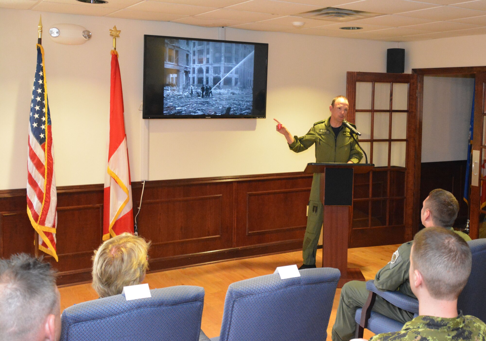 TYNDALL AIR FORCE BASE, Fla. – Royal Canadian Air Force BGen Alain Pelletier, Continental U.S. Aerospace Defense Region Deputy Commander, talks about a World War II scene from London during the Canadian Detachment’s Battle of Britain Remembrance Ceremony here Sept. 22. This year marked the 75th anniversary of the historic battle that helped change the tide of the war in Europe. (Photo Released/Courtesy Photo)