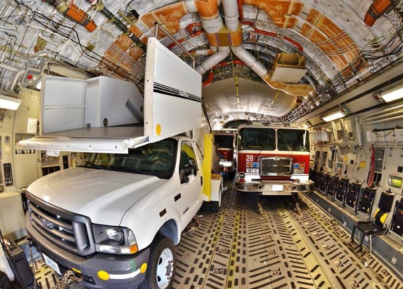 A tight fit, three rolling stock on C-17 Globemaster ready to support the presidential visit to Africa. (Courtesy Photo by Capt Jose A. Quintanilla)