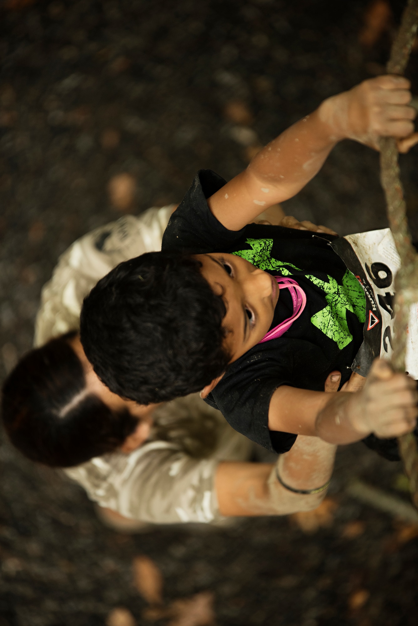 Melissa Espinoza helps her son Thaddeus through a rope obstacle during the 2015 “Beast of the East” Mud Run held Sept. 19, 2015 at Joint Base McGuire-Dix-Lakehurst, New Jersey. The grueling 10k course challenged participants from throughout the Northeast and offered a rare opportunity for community members to come through the gate.  (U.S. Air Force photo by Staff Sgt. Katherine Tereyama)