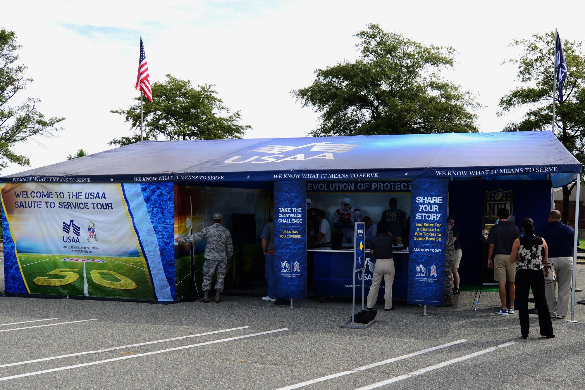 U.S. Service members check out the USAA Salute to Service Tour at Langley Air Force Base, Va., Sept. 17, 2015. The bank brought an interactive National Football League experience to U.S. Air Force Airmen and their families. (U.S. Air Force photo by Airmen 1st Class Derek Seifert/ Released)