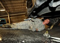 Senior Airman Charles Farber, 319th Logistics Readiness Squadron vehicle operations journeyman, hooks up a truck to a tow line Sept. 17, 2015, on Grand Forks Air Force Base, North Dakota. Farber was selected as the Warrior of the Week for the fourth week of September 2015. (U.S. Air Force photo by Airman 1st Class Ryan Sparks/Released)