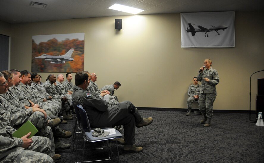 Col. Bobbi Doorenbos, 188th Wing commander, speaks on the acknowledgement of Airmen for their accomplishments Sept. 20, 2015, during a commander's call at Ebbing Air National Guard Base, Fort Smith, Ark. During the commander's call, recognized Airmen were awarded Outstanding Airman of the Quarter awards and Master Sgt. William Brown received the Air Force Combat Action Medal. (U.S. Air National Guard photo by Senior Airman Cody Martin/Released)