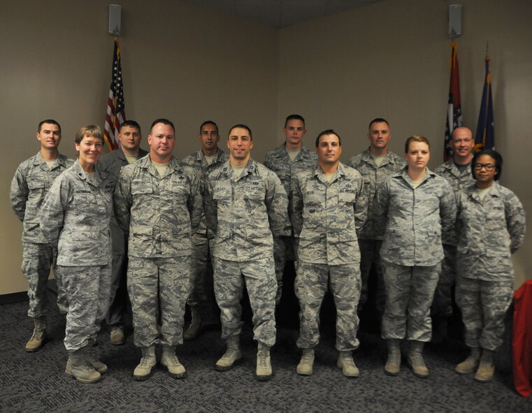 Nominees for the Outstanding Airman of the Quarter pose for a photo Sept. 19, 2015 during commander's call at Ebbing Air National Guard Base, Fort Smith, Ark. The Outstanding Airman of the Quarter program was restored to recognize individuals who distinguished themselves by exemplifying leadership and performance skills, self-improvement and physical fitness as well as base and community involvement. Airman 1st Class Tyler Price, Staff Sgt. Sasha Gray, Master Sgt. Derrick Phillips, 2nd Lt. David Smith and Maj. Casey Eubanks received the award for their respective group of ranks. (U.S. Air National Guard photo by Senior Airman Cody Martin/Released)