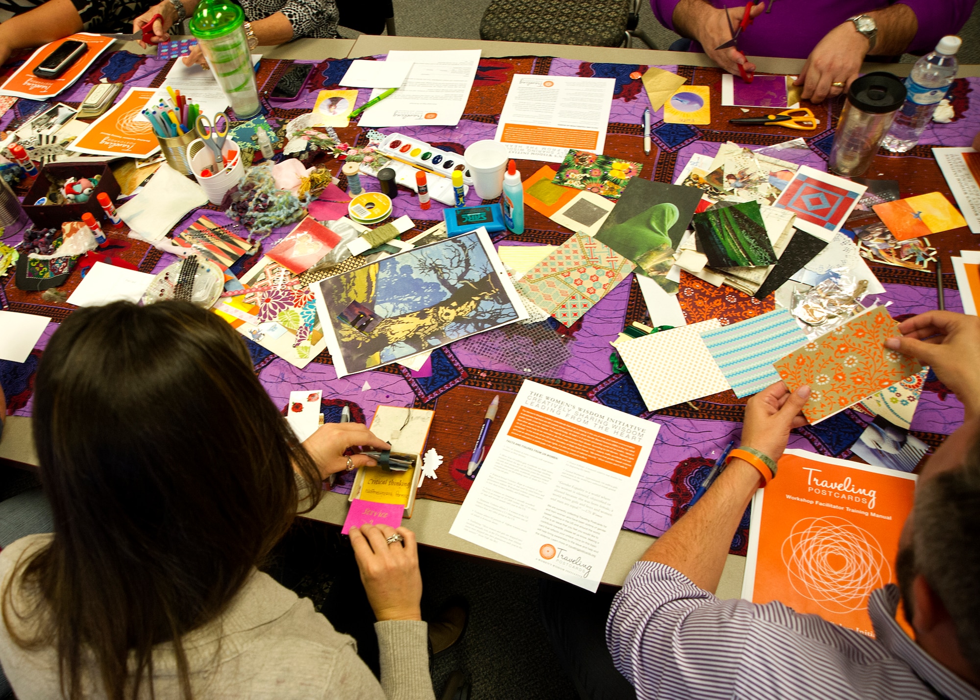 More than 20 Grissom Airmen, local, state and national therapists handcraft traveling postcards with phrases of empowerment and hope for survivors of domestic violence and sexual assault during a traveling postcard workshop at Grissom Air Reserve Base, Ind., Sept. 22, 2015. Traveling postcard workshops will be offered quarterly for Grissom Airmen in the near future. (U.S. Air Force photo/Senior Airman Katrina Heikkinen)