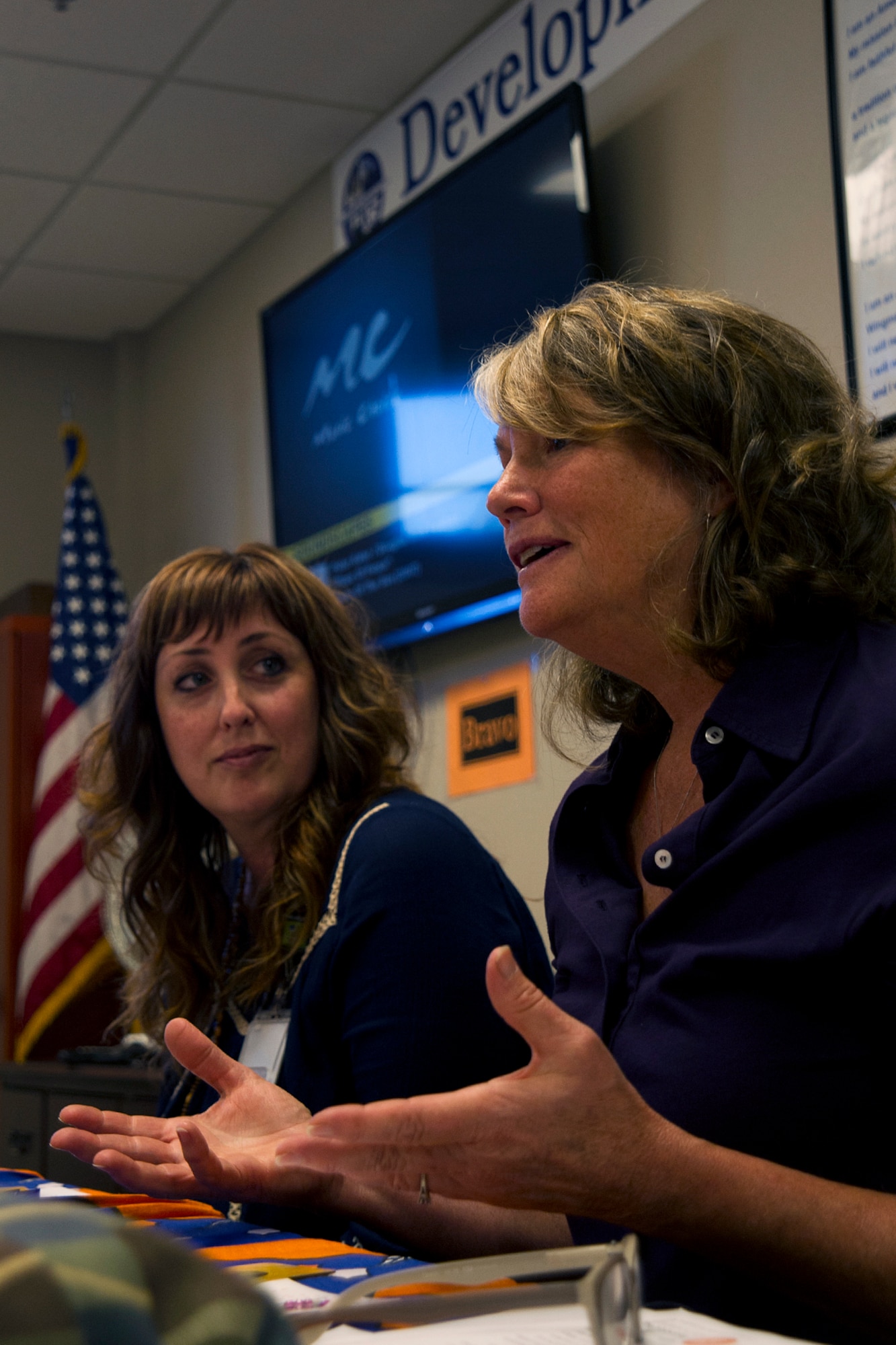 Caroline Lovell, traveling postcard workshops founder, discusses empowerment through transformative art during a healing arts workshop at Grissom Air Reserve Base, Ind., Sept. 22, 2015. Lovell's workshop aimed to provide healing for survivors of domestic violence and sexual assault, an avenue for attendees to express their creativity and foster an environment for attendees to share their own experiences without censorship. (U.S. Air Force photo/Senior Airman Katrina Heikkinen)