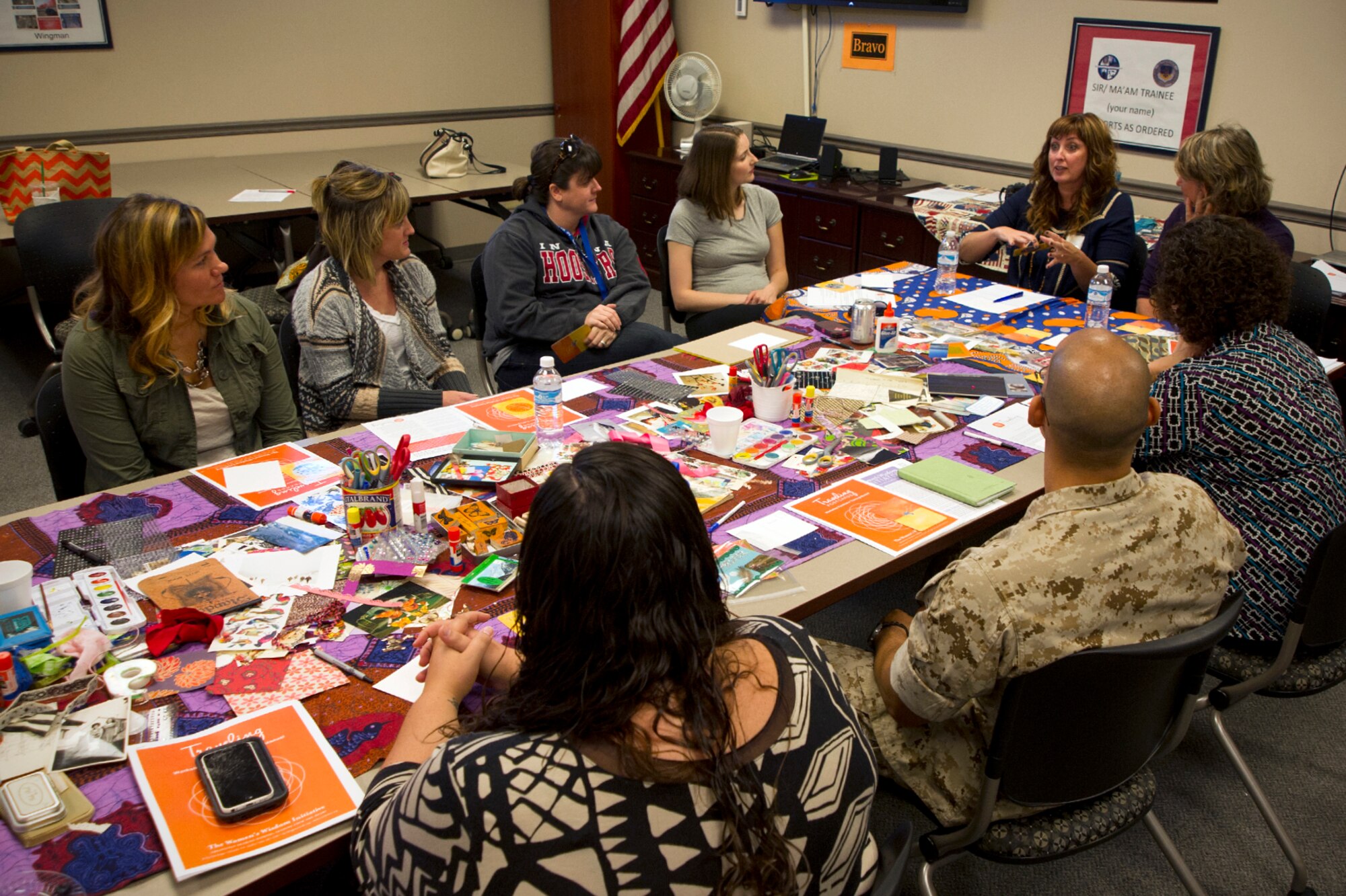 Amy Little, 434th Air Refueling Wing sexual assault and response coordinator and social worker, discusses words of empowerment during a transformative arts workshop at Grissom Air Reserve Base, Ind., Sept. 22, 2015. Traveling postcard workshops will be offered quarterly at Grissom in the near future. (U.S. Air Force photo/Senior Airman Katrina Heikkinen)