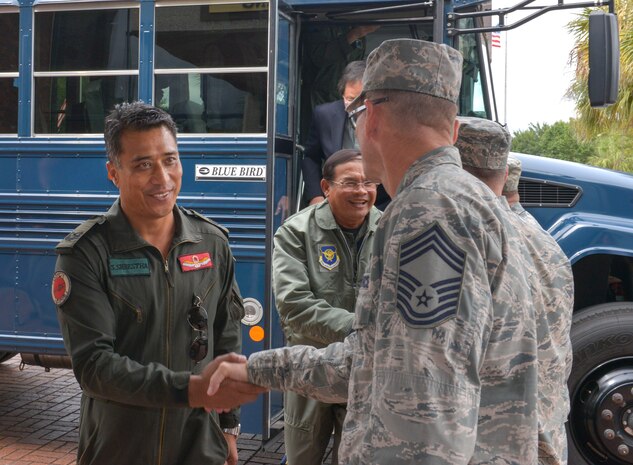 (From right to left) U.S. Air Force Chief Master Sgt. Robert Valenca, 628th Missions Support Group superintendent, greets Nepal Brig. Gen. Sudheer Shrestha, Army Aviation director general of Nepal, as he arrives at the headquarters building, Joint Base Charleston, South Carolina, Sept. 16, 2015. Shrestha, among several other Pacific Air Chiefs, received a briefing on the joint base mission by U.S. Air Force Col. Robert Lyman, 628th Air Base Wing commander; Col. John Lamontagne, 437th Airlift Wing commander; and Col. Gregory Gilmour, 315th Airlift Wing commander, as part of their visit for the Pacific Air Chiefs Symposium. The air chiefs, from Australia, Cambodia, Mongolia, Nepal, Bangladesh, Japan and the Philippines, visited JB Charleston as part of the Pacific Air Chiefs Symposium. The symposium helps further the Air Force's partnership with the countries by showcasing the mission and operations at various Air Force bases around the U.S.  (U.S. Air Force photo/Airman 1st Class Thomas T. Charlton)