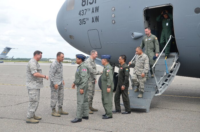 (Left to right)U.S. Air Force Col. Gregory Gilmour, 315th Airlift Wing commander; Col. John Lamontagne, 437th Airlift Wing commander; and Col. Robert Lyman, 628th Air Base Wing commander, greet the Pacific Air Chiefs Sept. 16, 2015, Joint Base Charleston, South Carolina. The air chiefs, from Australia, Cambodia, Mongolia, Nepal, Bangladesh, Japan and the Philippines, visited JB Charleston as part of the Pacific Air Chiefs Symposium. The symposium helps further the Air Force's partnership with the countries by showcasing the mission and operations at various Air Force bases around the U.S. (U.S. Air Force photo/Capt. Brian Walker)