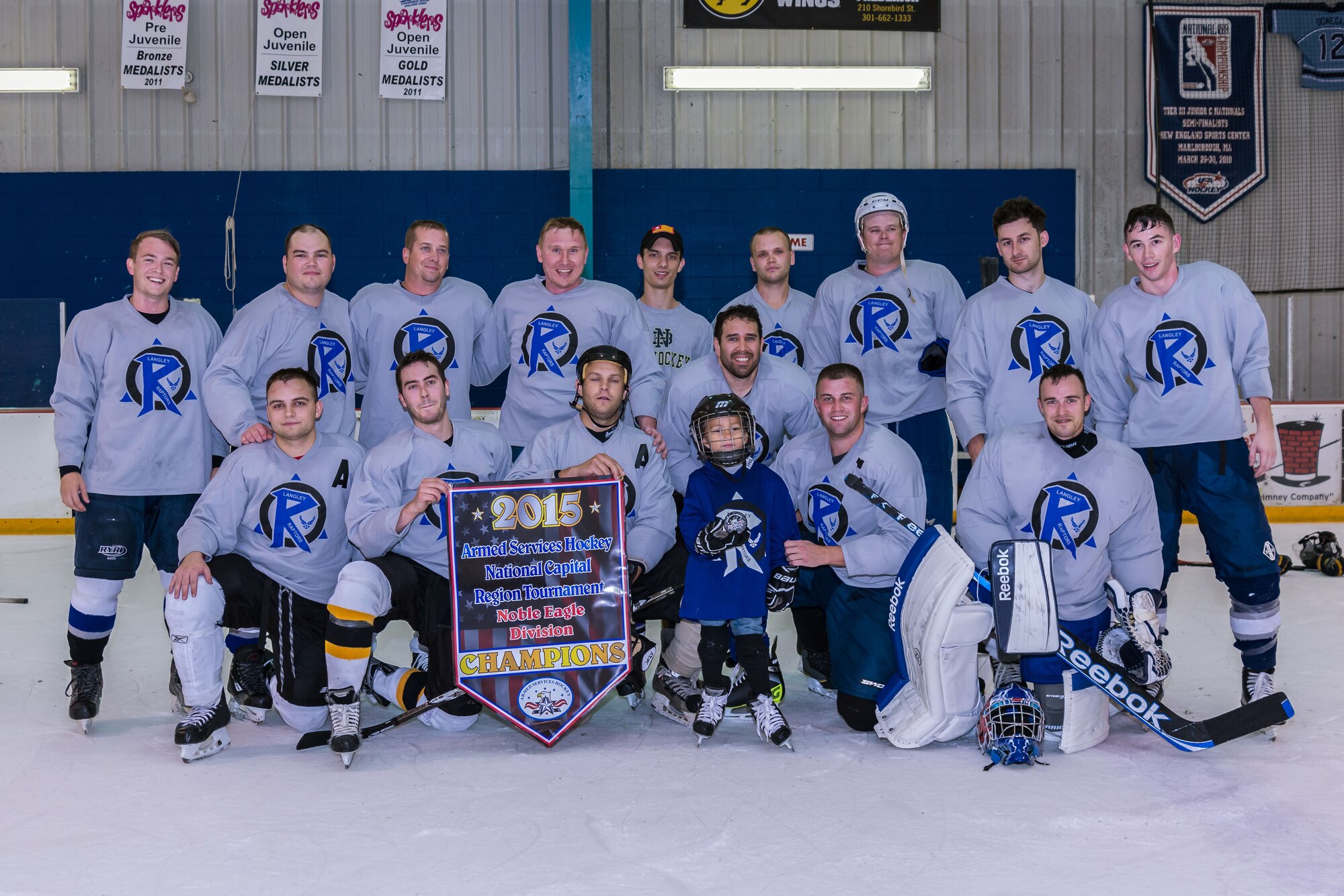 U.S. Air Force Airmen pose after winning the 2015 Armed Service Hockey Association National Capital Region tournament in Fredrick, M.D., Aug. 16, 2015. The hockey team was formed by Staff Sgt. Eric Luttrell, 10th Intelligence Squadron cyber transport craftsman, and the team is comprised of 25 members stationed at Langley Air Force Base, Va. (Courtesy photo by Mike Duggan)