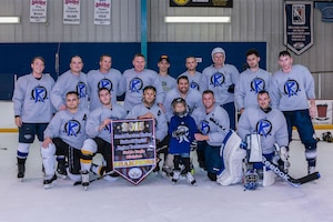 U.S. Air Force Airmen pose after winning the 2015 Armed Service Hockey Association National Capital Region tournament in Fredrick, M.D., Aug. 16, 2015. The hockey team was formed by Staff Sgt. Eric Luttrell, 10th Intelligence Squadron cyber transport craftsman, and the team is comprised of 25 members stationed at Langley Air Force Base, Va. (Courtesy photo by Mike Duggan)