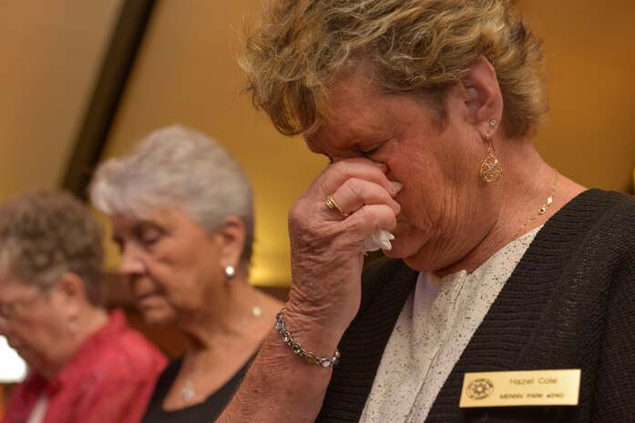 Hazel Cole, a member of the Navy Wives Club of America, takes a moment of silence during the Navy Gold Star Remembrance event to honor fallen Sailors Sept. 23, 2015 at the Good Shepherd Chapel on Joint Base Charleston –Weapons Station, Charleston, S.C. Military members and civilians joined the Navy Wives Club participating in the ceremony. The Navy Gold Star Remembrance event honored local deceased Sailors.