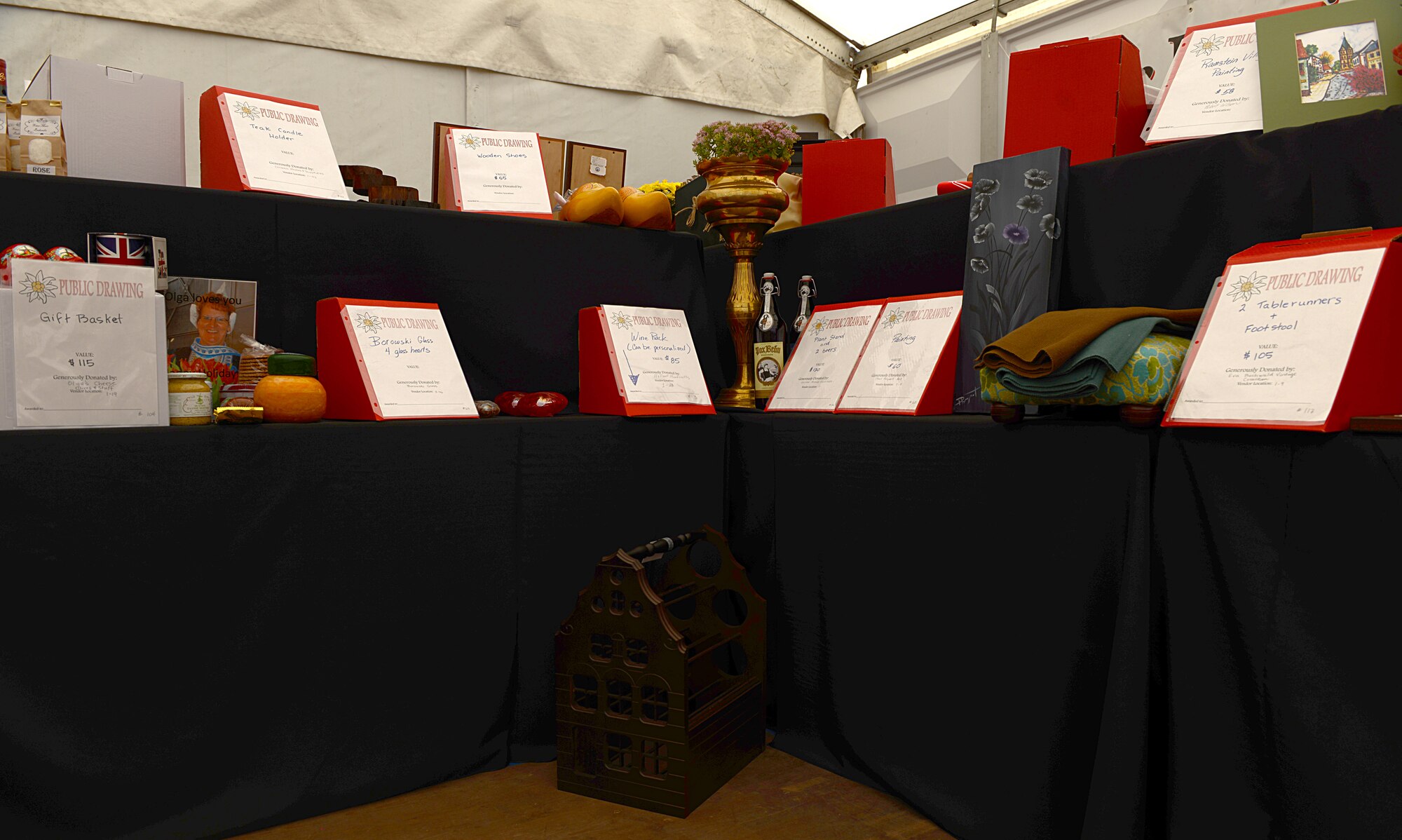Prizes for the Ramstein Officers’ Spouses Club’s gift drawing are displayed at the 51st Ramstein Bazaar Sept. 19, 2015, at Ramstein Air Base, Germany. The prizes were donated by vendors set up at the bazaar. (U.S. Air Force photo/Senior Airman Timothy Moore)