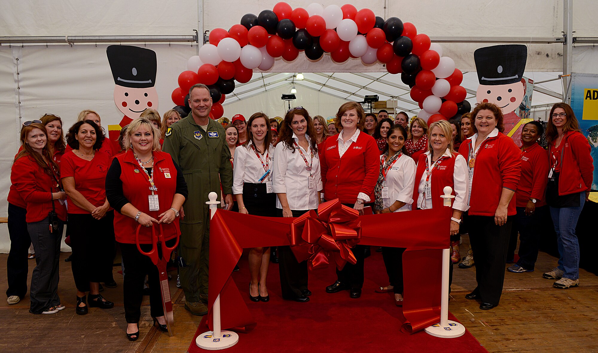 Brig. Gen. Jon T. Thomas, 86th Airlift Wing commander, poses for a photo with members of the Ramstein Bazaar committee and Ramstein Officers’ Spouses Club Sept. 16, 2015, at Ramstein Air Base, Germany. The bazaar is an official 86th Force Support Squadron event. (U.S. Air Force photo/Senior Airman Timothy Moore)