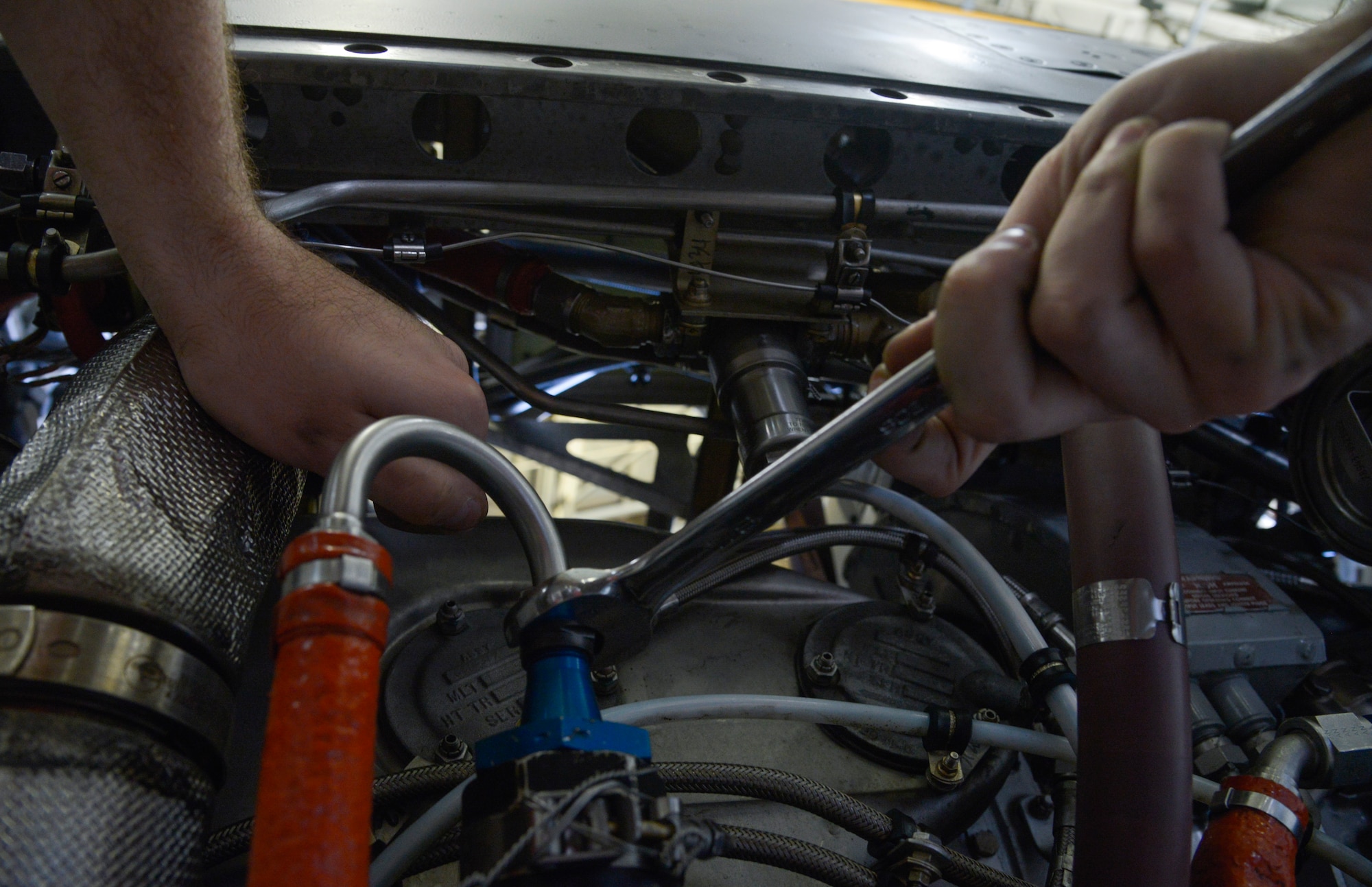 Airman Sam Johnson, 374th Maintenance Squadron propulsion flight aerospace propulsion apprentice, tightens a bolt on a low-pressure fuel filter on an engine at Yokota Air Base, Japan, Sept. 23, 2015. In addition to providing support for both Yokota and Kadena Air Base, the flight provides engine and propeller support for all active duty, guard and reserve C-130s tasked within their area of responsibility. (U.S. Air Force photo by Senior Airman David Owsianka/Released)