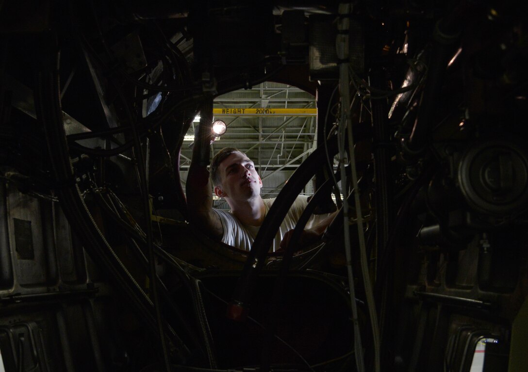 Senior Airman Devin Truesdell, 374th Maintenance Squadron propulsion flight aerospace propulsion journeyman, examines a quick engine change kit at Yokota Air Base, Japan, Sept. 23, 2015. The propulsion flight Airmen fix C-130 Hercules engines for both Yokota and Kadena Air Base. (U.S. Air Force photo by Senior Airman David Owsianka)