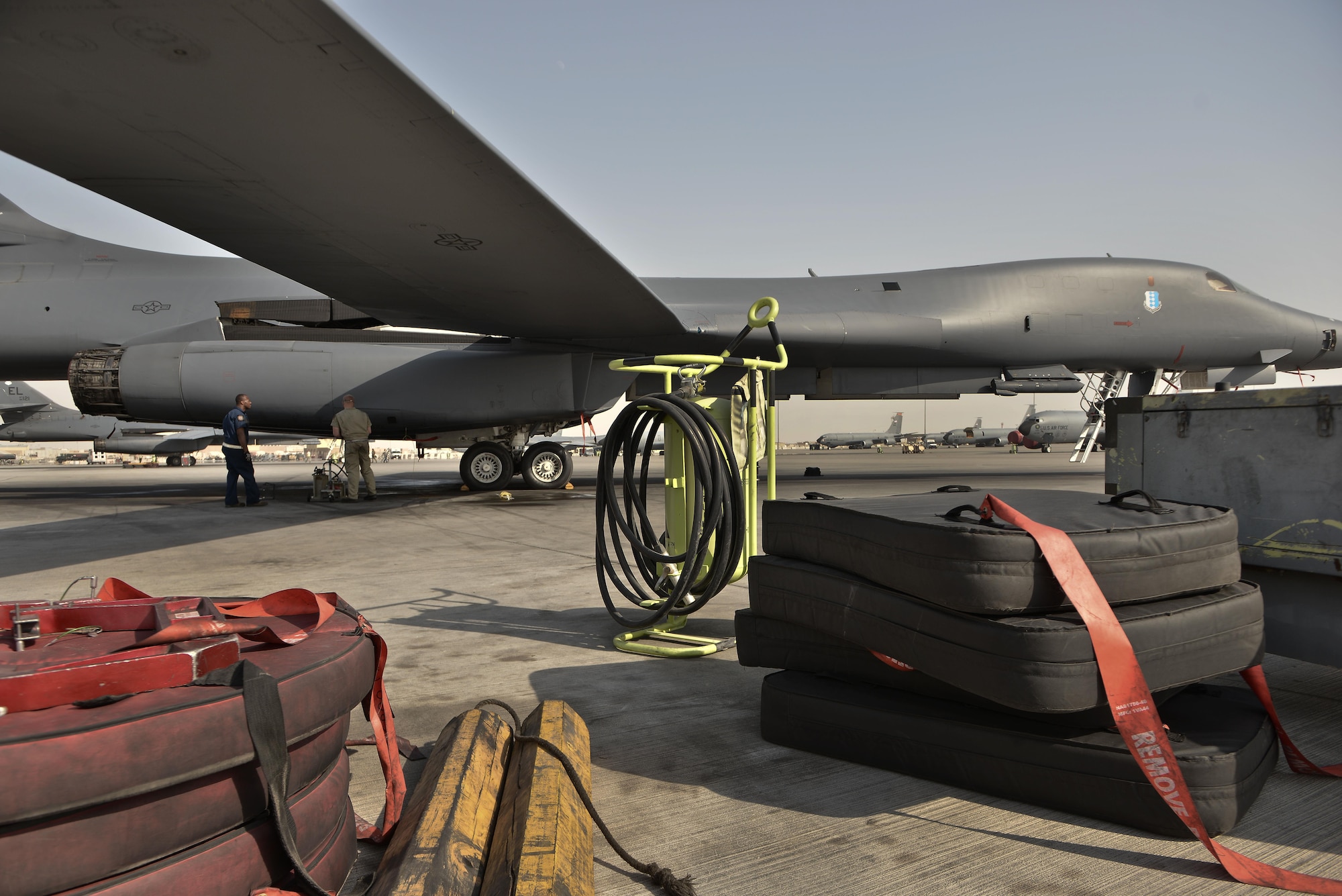 Tech. Sgt Nasir Ahmad and Airman 1st Class James Balcom, 37th Aircraft Maintenance Unit crew chiefs, check several sections of a B1-B Lancer as part of their final inspection to ready the aircraft before an aircrew boards for a mission September 22, 2015 at Al Udeid Air Base, Qatar. Ahmad and Balcom are deployed from Ellsworth Air Force Base, S.D. (U.S. Air Force photo/Staff Sgt. Alexandre Montes)