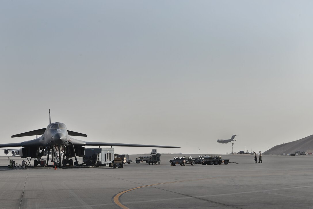 Crew chiefs of the 37th Aircraft Maintenance Unit conduct preventative maintenance on a B1-B Lancer September 22, 2015 at Al Udeid Air Base, Qatar. The aircraft is assigned to the 37th Expeditionary Bomber Squadron. (U.S. Air Force photo/Staff Sgt. Alexandre Montes) 