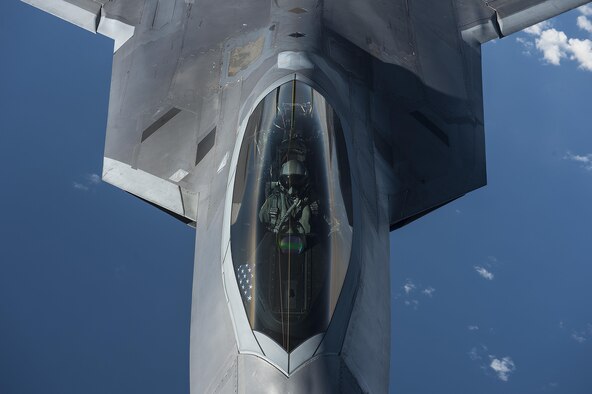 A U.S. Air Force F-22 Raptor pilot from the 95th Fighter Squadron, Tyndall Air Force Base, Fla., flies over the Baltic Sea Sept. 4, 2015. The U.S. Air Force has deployed four F-22 Raptors, one C-17 Globemaster III, approximately 60 Airmen and associated equipment to Spangdahlem Air Base, Germany. While these aircraft and Airmen are in Europe, they will conduct air training with other Europe-based aircraft. (U.S. Air Force photo by Tech. Sgt. Jason Robertson/Released)