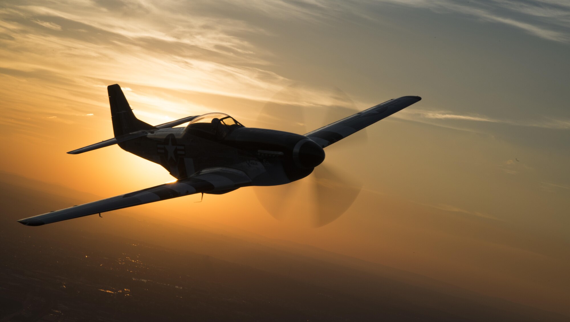 A P-51 Mustang flies over Joint Base Anacostia-Bolling, Washington, during a military tattoo Sept. 16, 2015. (U.S. Air Force photo/Airman 1st Class Philip Bryant)