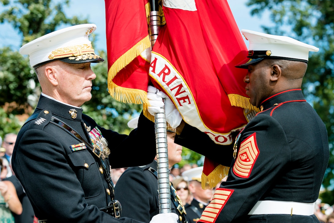 Marine Corps Gen. Joseph F. Dunford Jr., outgoing commandant of the Marine Corps, receives the Marine Corps colors from Sgt. Maj. of the Marine Corps Ronald L. Green during the Marine Corps passage of command ceremony on Marine Barracks Washington, D.C., Sept. 24, 2015. Dunford relinquished command to Gen. Robert B. Neller. DoD photo by Army Staff Sgt. Sean K. Harp
