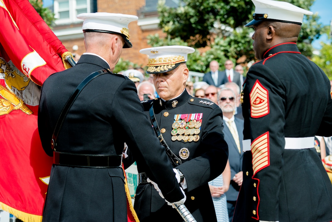 Marine Corps Gen. Joseph F. Dunford Jr., outgoing commandant of the Marine Corps, passes the Marine Corps colors to Gen. Robert B. Neller, the incoming commandant, during the Marine Corps passage of command ceremony on Marine Barracks Washington, D.C., Sept. 24, 2015. DoD photo by Army Staff Sgt. Sean K. Harp