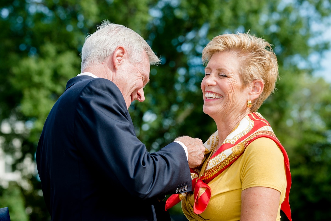 Navy Secretary Ray Mabus presents an award to Ellyn Dunford during the Marine Corps passage of command ceremony on Marine Barracks Washington, D.C., Sept. 24, 2015. Gen. Joseph F. Dunford Jr. relinquished command to Gen. Robert B. Neller. DoD photo by Army Staff Sgt. Sean K. Harp