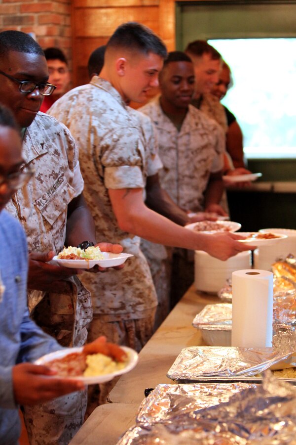 Marines with Headquarters and Headquarters Squadron and Marine Transport Squadron 1 participate in a bi-annual Pig Picking sponsored by the Havelock Military Affairs Committee at Marine Corps Air Station Cherry Point, N.C., Sept. 22, 2015. The event was held to show the community’s appreciation to the Marines and thank the service members on Cherry Point for their service. (U.S. Marine Corps photo by Pfc. Nicholas P. Baird/ Released)