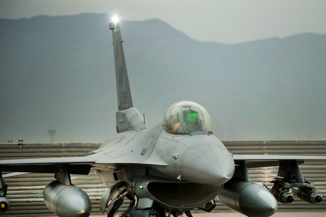 An F-16 Fighting Falcon pilot goes through a preflight inspection before a combat sortie from Bagram Airfield, Afghanistan, Sept. 22, 2015. U.S. Air Force photo by Tech. Sgt. Joseph Swafford